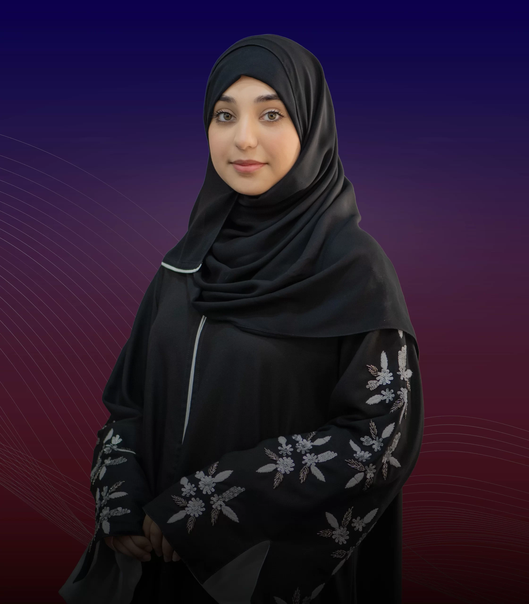 A woman wearing a black hijab posing for a photo, embodying grace and elegance in her attire, capturing the essence of Maimoona Zahir's persona.